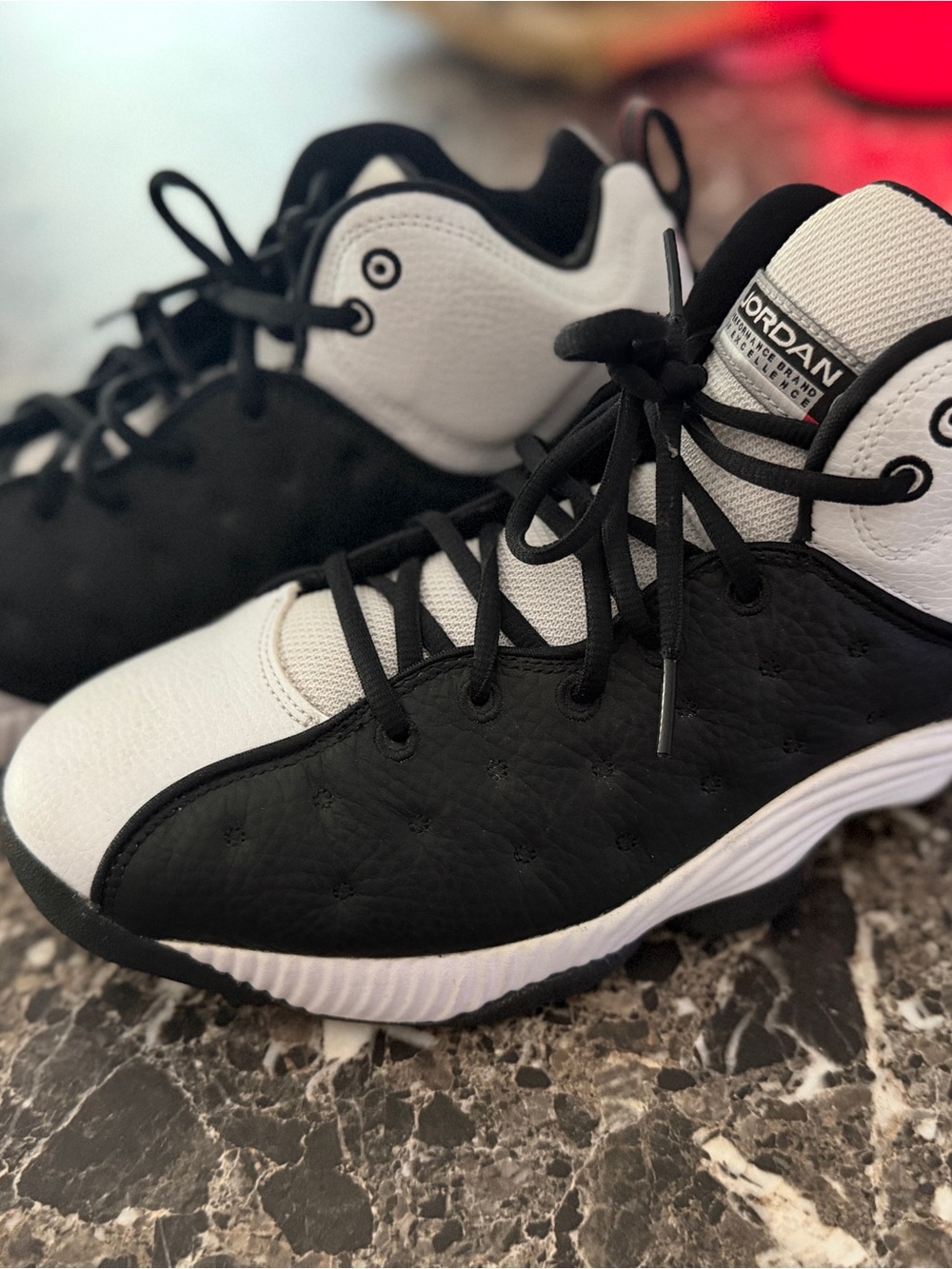 Jordan Retro’s Black & White Athletic Shoes